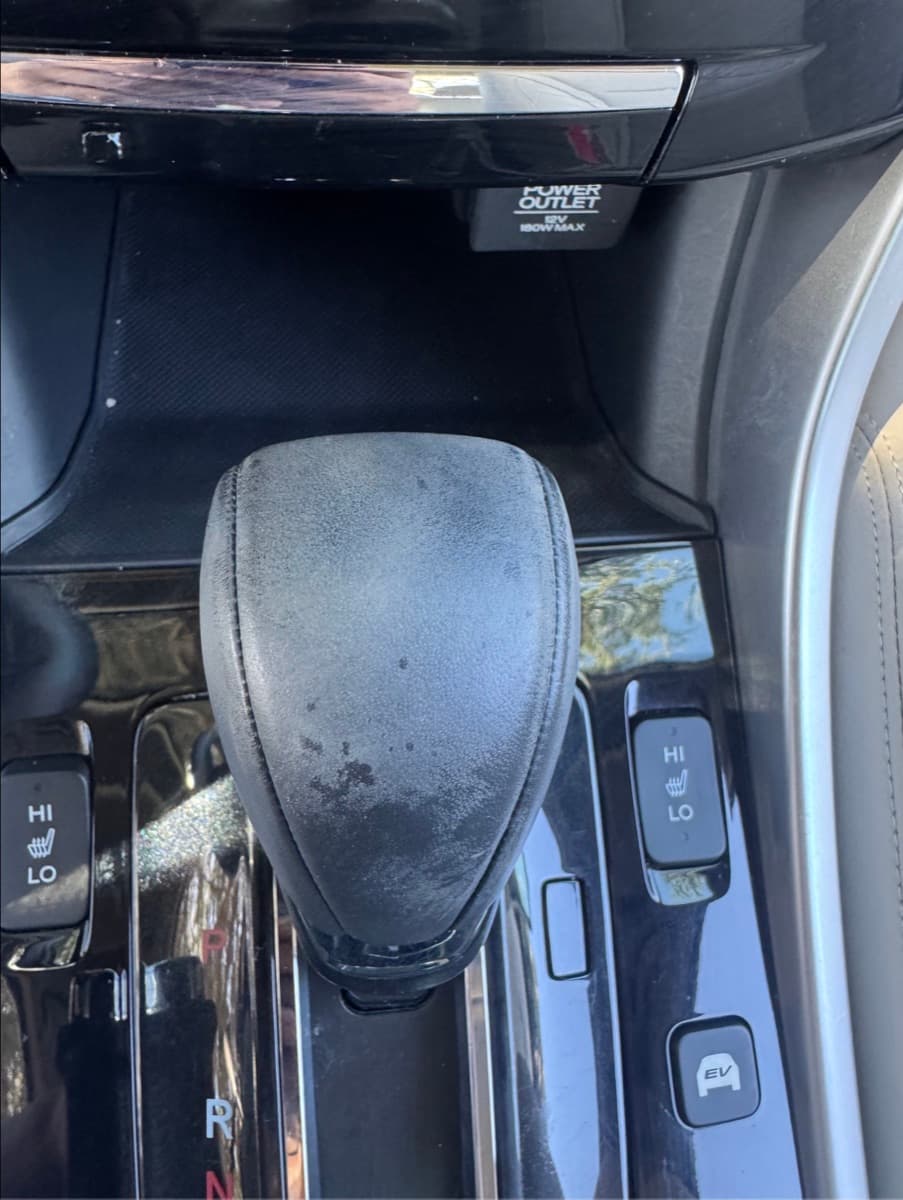 Honda shifter knob before — dusty, worn leather