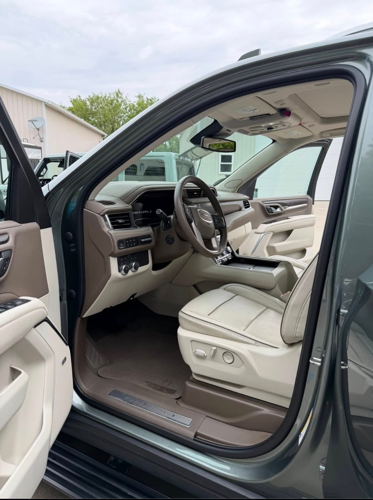 GMC Yukon with tan leather cabin after a full inside-and-out detail